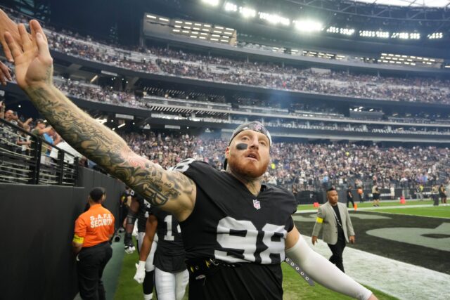 Aug 14, 2022; Paradise, Nevada, USA; Las Vegas Raiders defensive end Maxx Crosby (98) greets fans before the game against the Minnesota Vikings at Allegiant Stadium. Mandatory Credit: Kirby Lee-USA TODAY Sports Maxx Crosby, Raiders