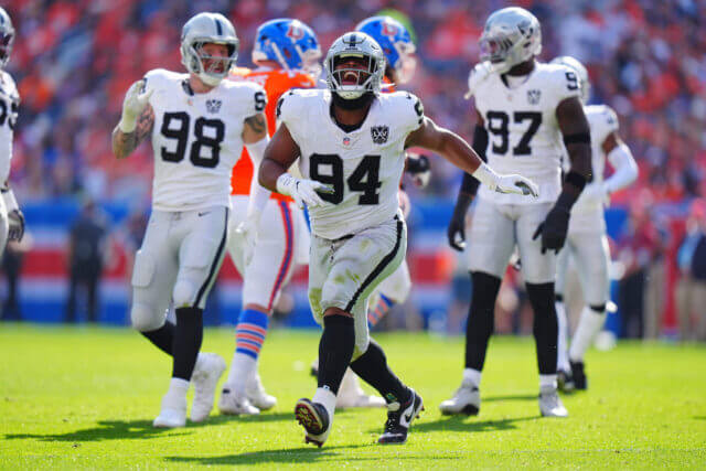 Oct 6, 2024; Denver, Colorado, USA; Las Vegas Raiders defensive tackle Christian Wilkins (94) celebrates his sack in the second quarter against the Denver Broncos at Empower Field at Mile High. Mandatory Credit: Ron Chenoy-Imagn Images Christian Wilkins, Raiders