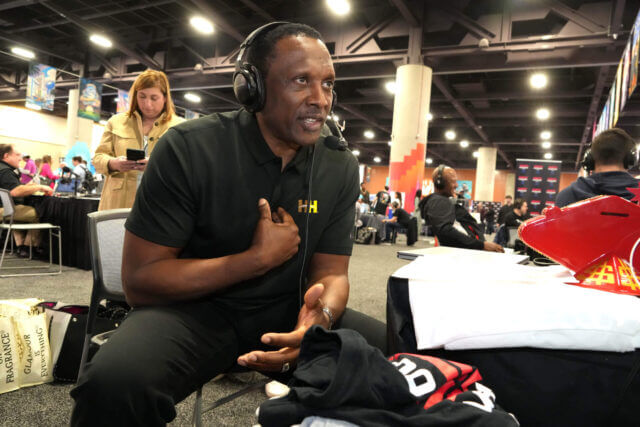 Feb 9, 2023; Phoenix, AZ, USA; Los Angeles and former Oakland Raiders receiver Tim Brown on radio row at the Super Bowl LVII media center at the Phoenix Convention Center. Mandatory Credit: Kirby Lee-USA TODAY Sports Tim Brown, Raiders
