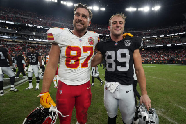 Oct 27, 2024; Paradise, Nevada, USA; Kansas City Chiefs tight end Travis Kelce (87) and Las Vegas Raiders tight end Brock Bowers (89) pose after the game at Allegiant Stadium. Mandatory Credit: Kirby Lee-Imagn Images Travis Kelce, Chiefs, Brock Bowers, Raiders