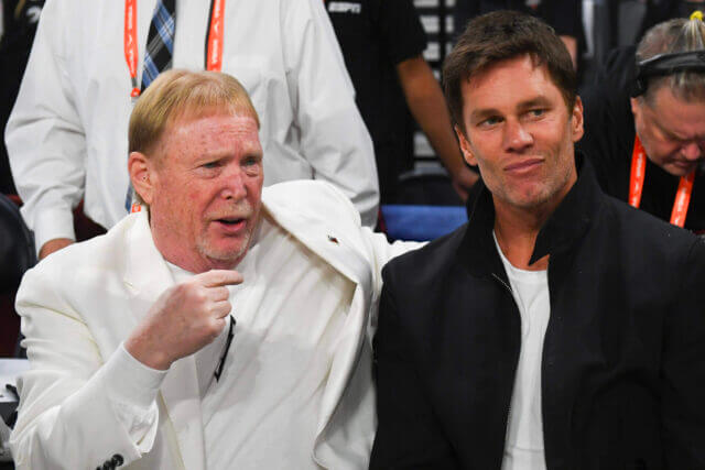 Oct 8, 2023; Las Vegas, Nevada, USA; Las Vegas Aces owner Mark Davis and part-owner Tom Brady talk before the game between the Las Vegas Aces and the New York Liberty during game one of the 2023 WNBA Finals at Michelob Ultra Arena. Mandatory Credit: Candice Ward-USA TODAY Sports Tom Brady, Mark Davis, Raiders