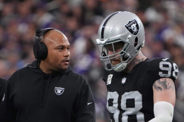 Dec 10, 2023; Paradise, Nevada, USA; Las Vegas Raiders coach Antionio Pierce (left) talks with defensive end Maxx Crosby (98) n the first half against the Minnesota Vikings at Allegiant Stadium. Mandatory Credit: Kirby Lee-USA TODAY Sports Antonio Pierce, Maxx Crosby, Raiders