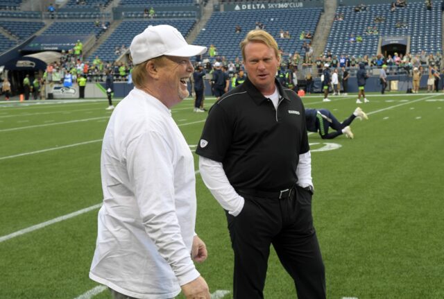 Aug 29, 2019; Seattle, WA, USA; Oakland Raiders owner Mark Davis (left) talks with head coach Jon Gruden before the game against the Seattle Seahawks at CenturyLink Field. Mandatory Credit: Kirby Lee-USA TODAY Sports Mark Davis, Jon Gruden, Raiders