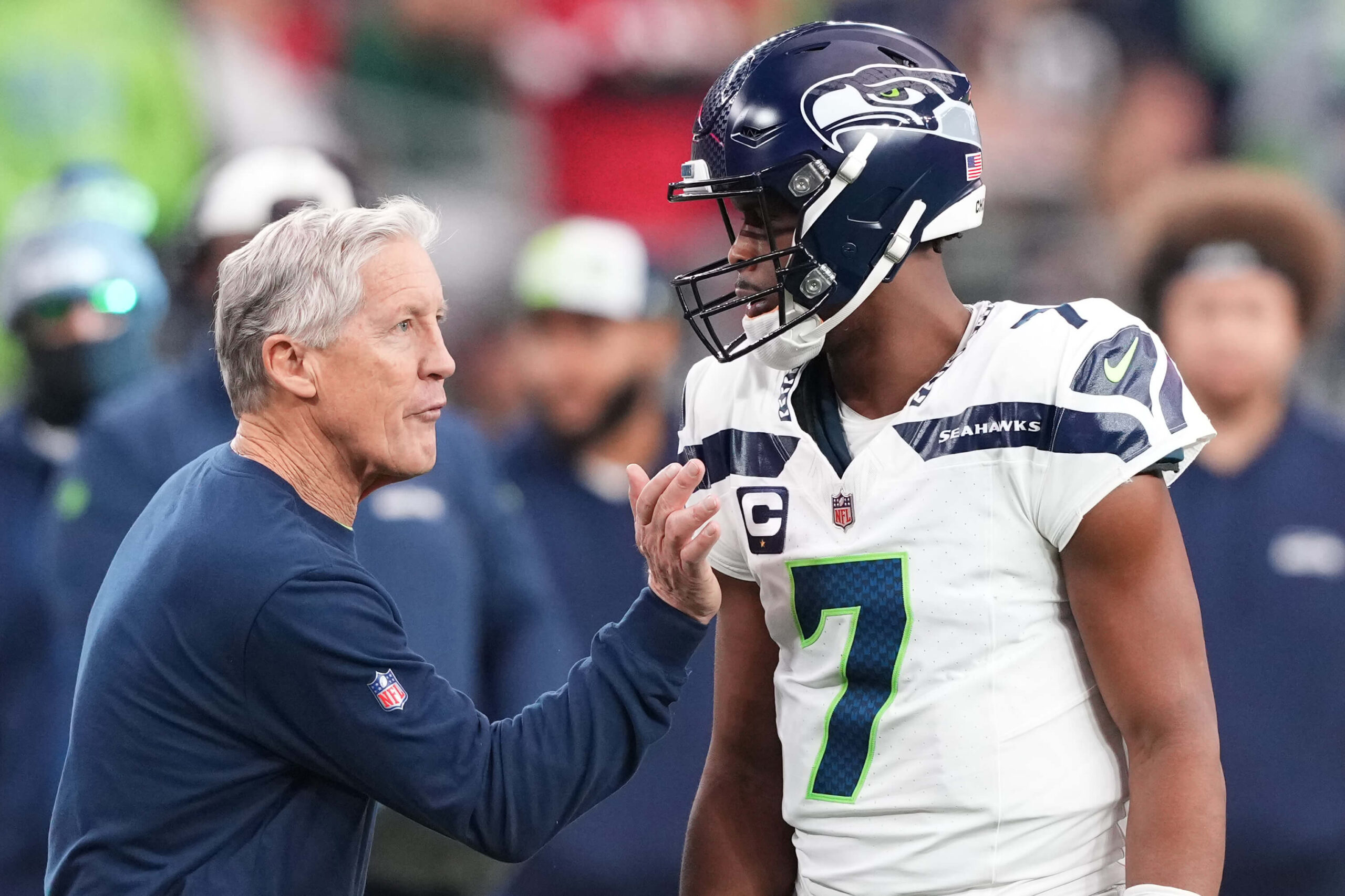 Jan 7, 2024; Glendale, Arizona, USA; Seattle Seahawks head coach Pete Carroll talks with Seattle Seahawks quarterback Geno Smith (7) during the first half of the game against the Arizona Cardinals at State Farm Stadium. Mandatory Credit: Joe Camporeale-USA TODAY Sports Geno Smith, Pete Carroll, Seahawks, Raiders
