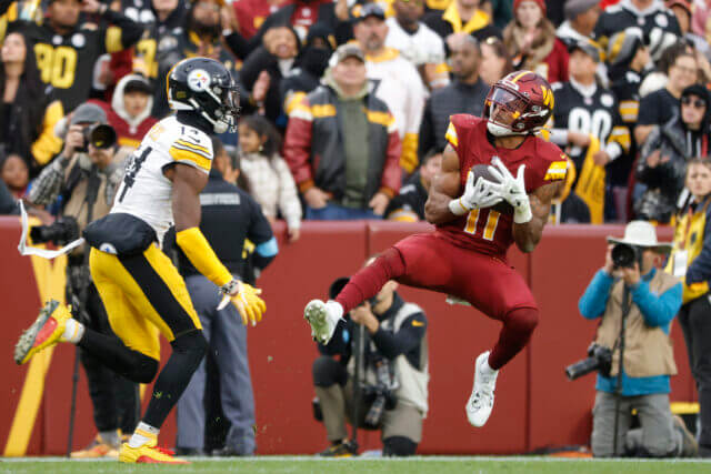 Nov 10, 2024; Landover, Maryland, USA; Washington Commanders safety Jeremy Chinn (11) intercepts a pass intended for Pittsburgh Steelers wide receiver George Pickens (14) during the second half at Northwest Stadium. Mandatory Credit: Amber Searls-Imagn Images Jeremy Chinn, Raiders, Commanders