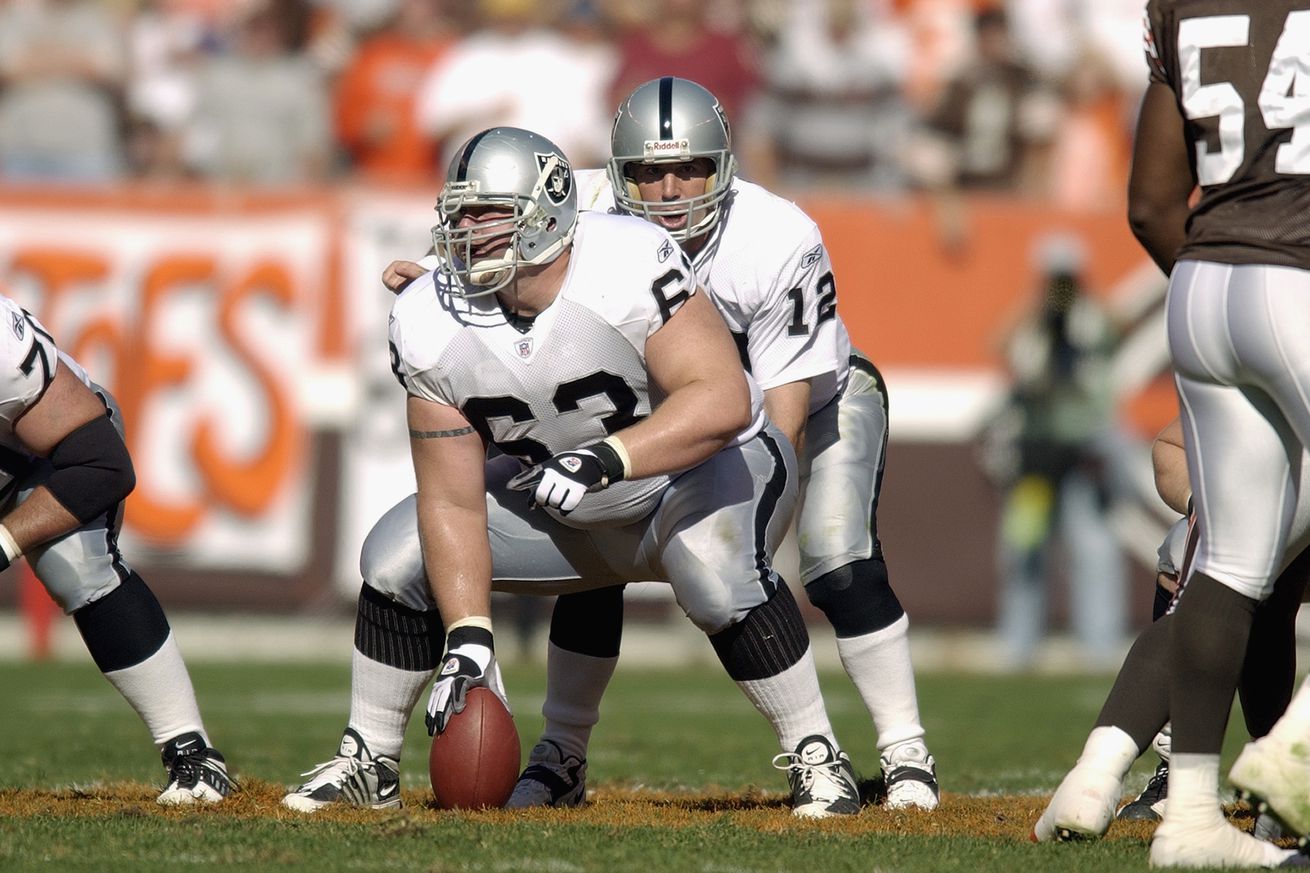 Barret Robbins snaps the ball to Rich Gannon