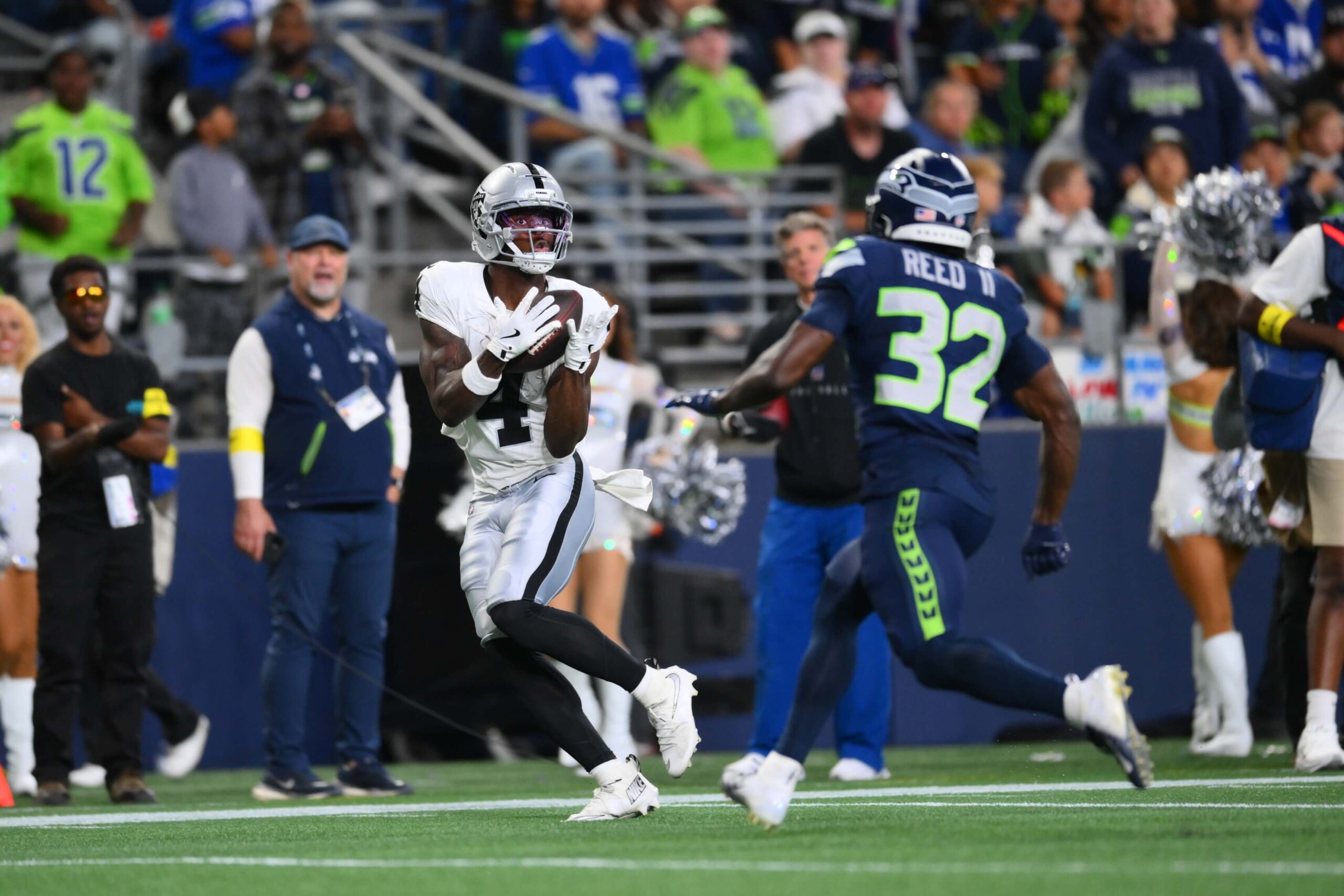 Aug 7, 2025; Seattle, Washington, USA; Las Vegas Raiders wide receiver Shedrick Jackson (4) catches a pass for a touchdown against the Seattle Seahawks during the second half at Lumen Field. Mandatory Credit: Steven Bisig-Imagn Images