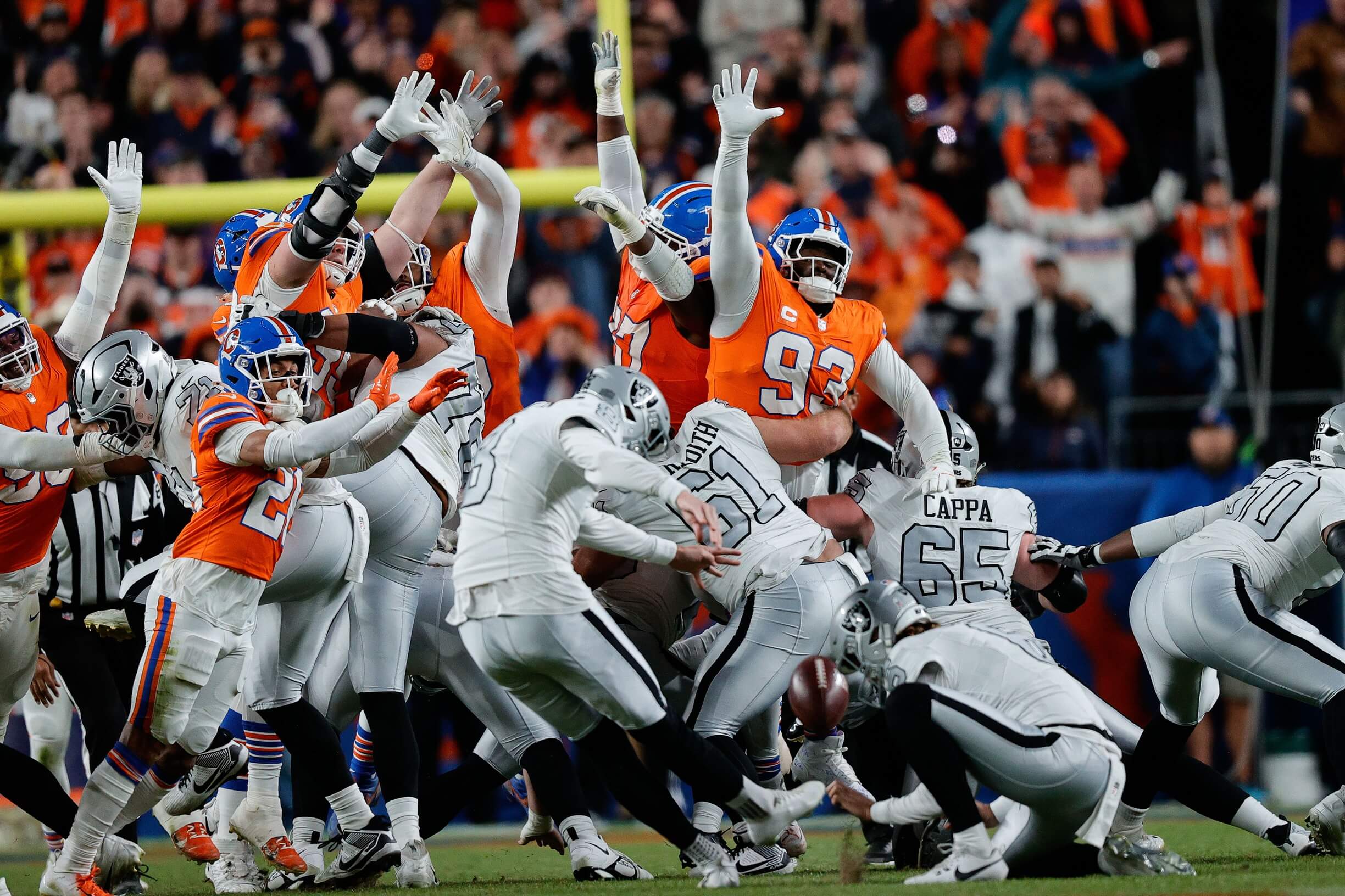 Nov 6, 2025; Denver, Colorado, USA; Las Vegas Raiders place kicker Daniel Carlson (8) misses a field goal as Denver Broncos defensive tackle D.J. Jones (93) and wide receiver A.T. Perry (87) defend in the fourth quarter at Empower Field at Mile High. Mandatory Credit: Isaiah J. Downing-Imagn Images